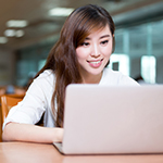 Young woman using laptop.