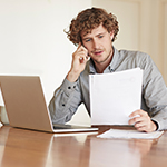 Man reviewing paperwork.